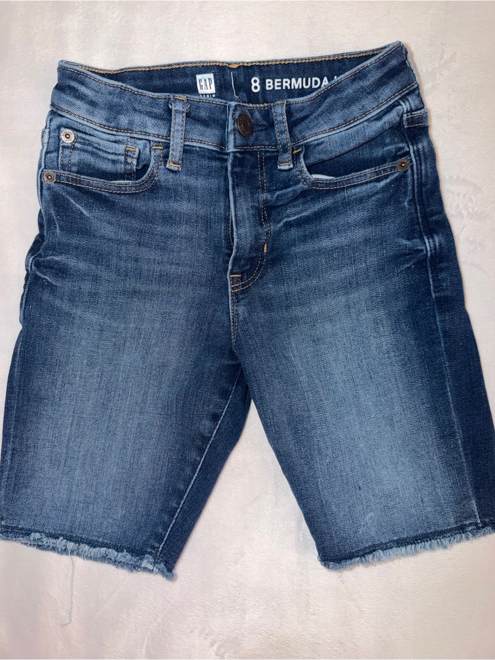 GAP High Rise Bermuda Denim Shorts in Medium Blue.